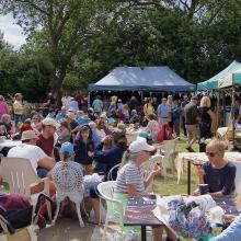 Lots of visitors enjoying refreshments at last year's Northfields Allotments' Summer Open Day